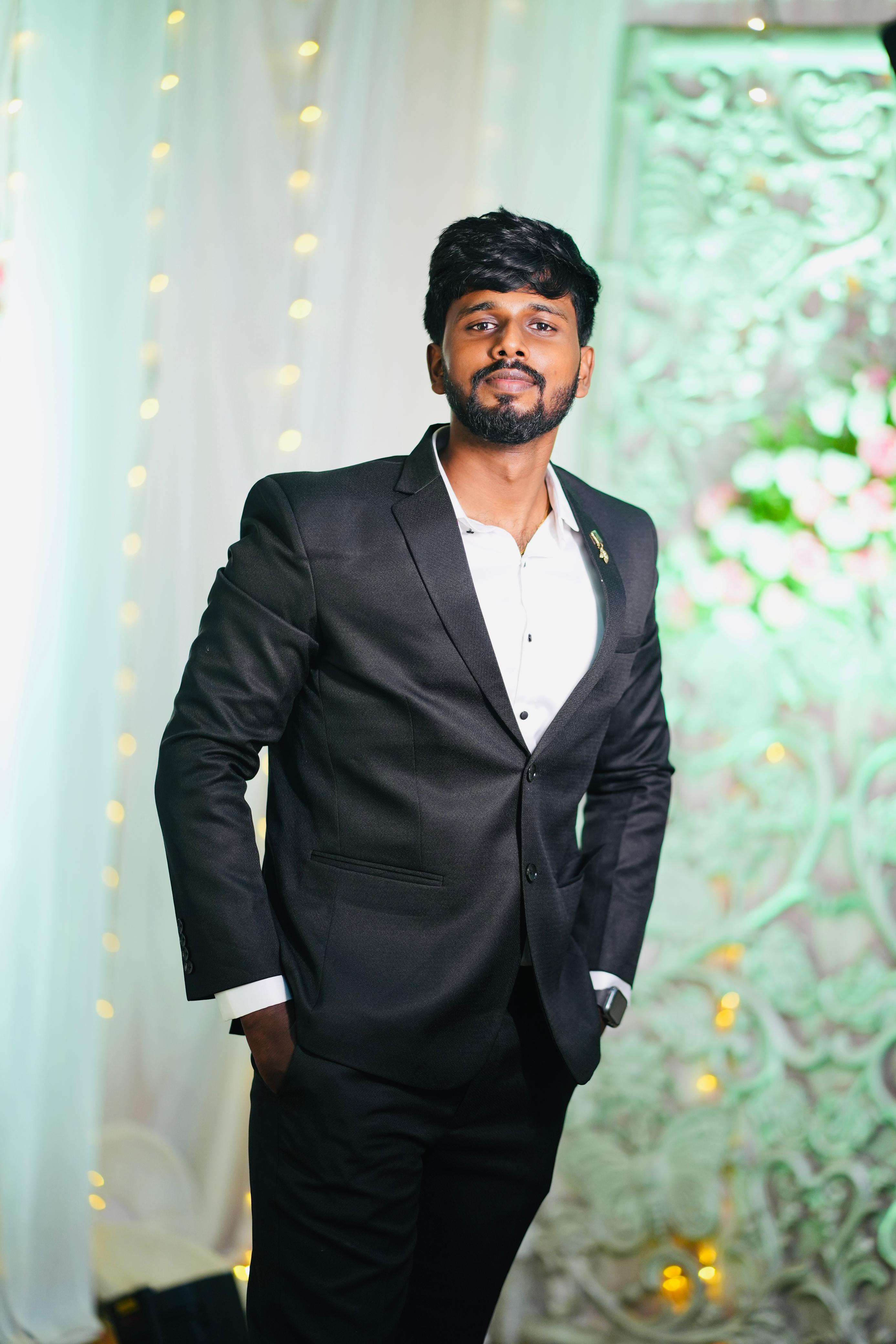 Francis Samuel in a black suit
